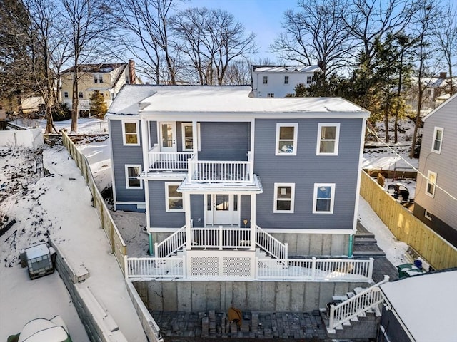 view of front of property featuring a balcony