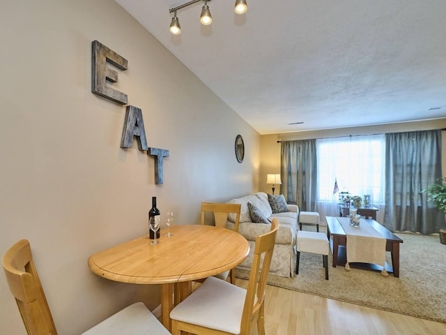 71 Princeton St Unit 305, Chelmsford, MA 01863 - dining area with light wood-type flooring and rail lighting