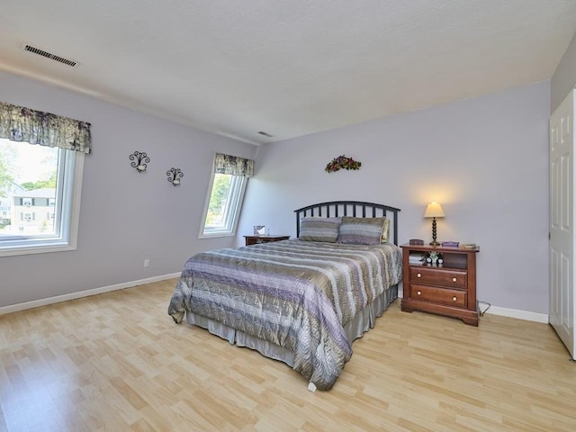 71 Princeton St Unit 305, Chelmsford, MA 01863 - bedroom with light wood-type flooring and baseboards