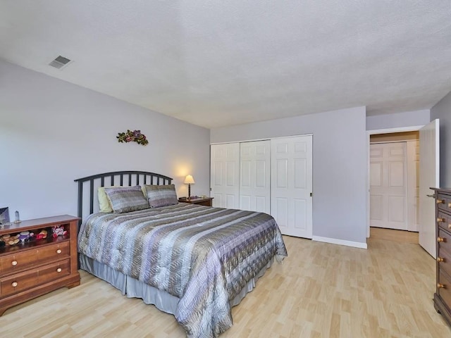 71 Princeton St Unit 305, Chelmsford, MA 01863 - bedroom with wood finished floors, a closet, and baseboards