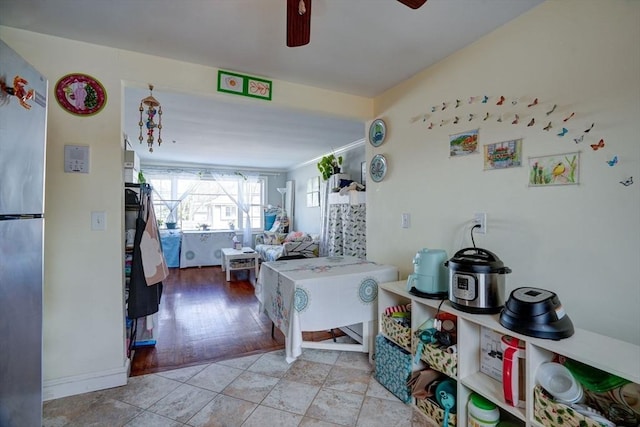 kitchen with ceiling fan and stainless steel fridge