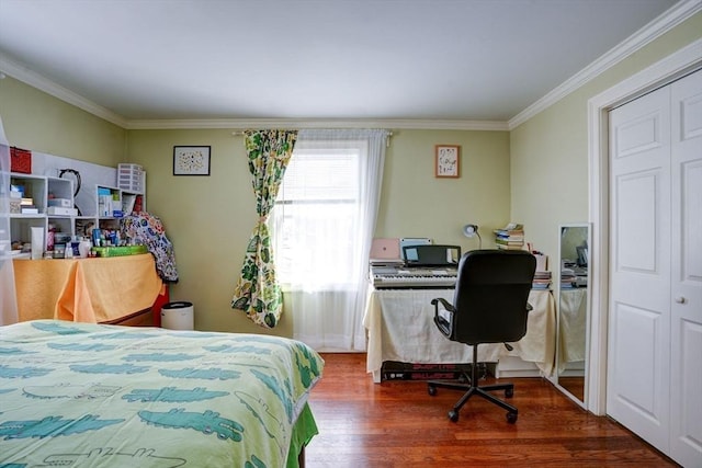 bedroom featuring hardwood / wood-style flooring and ornamental molding