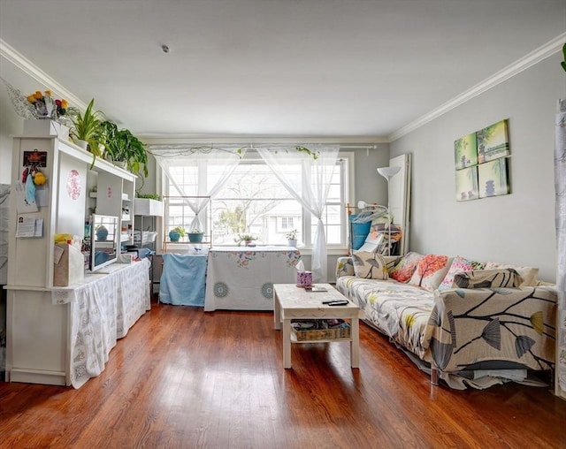 living room with ornamental molding and hardwood / wood-style flooring