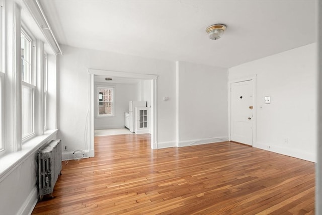 97 Chester St Unit 8, Boston, MA 02134 - spare room with radiator and light wood-style flooring