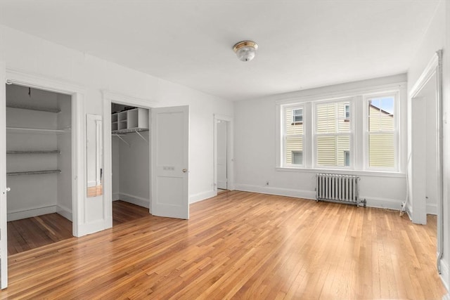 97 Chester St Unit 8, Boston, MA 02134 - unfurnished bedroom with radiator and light wood-type flooring