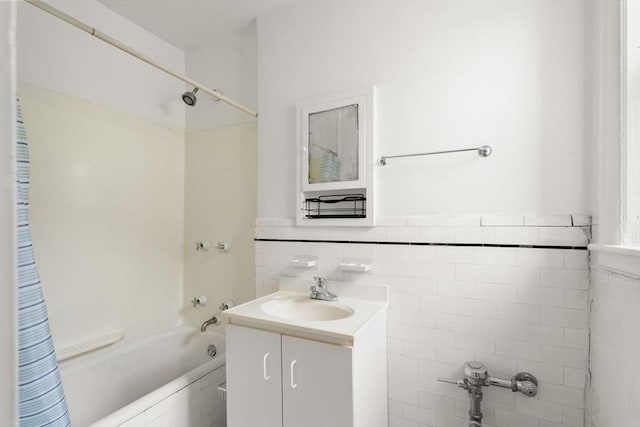 97 Chester St Unit 8, Boston, MA 02134 - bathroom featuring vanity, bathtub / shower combination, and tile walls