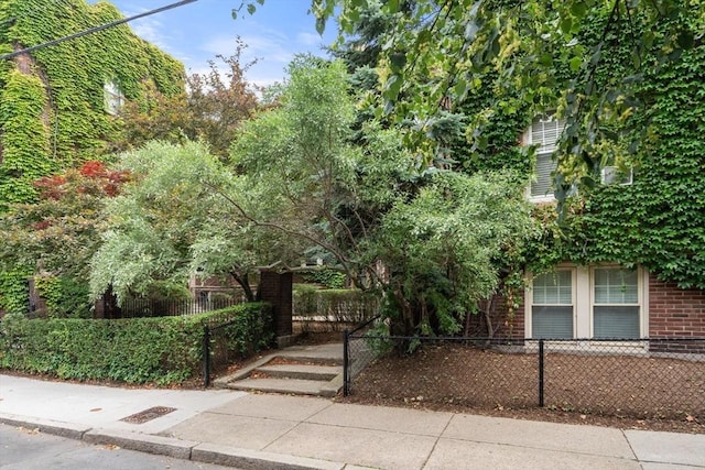 97 Chester St Unit 8, Boston, MA 02134 - obstructed view of property featuring a fenced front yard and brick siding