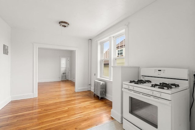 97 Chester St Unit 8, Boston, MA 02134 - kitchen with gas range gas stove, radiator heating unit, and light wood-style floors