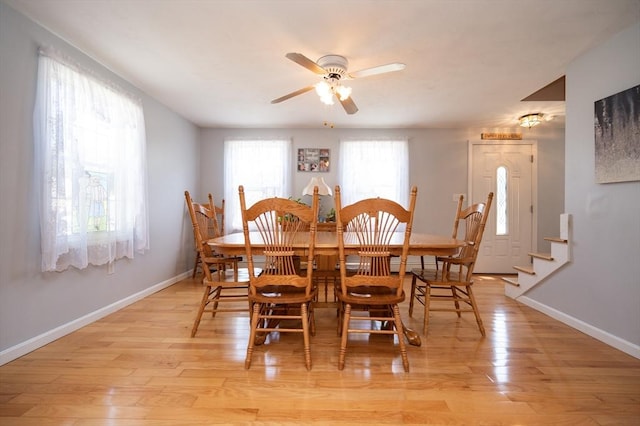 2 Garden St, Uxbridge, MA 01569 - dining room featuring baseboards, ceiling fan, light wood-style floors, and stairs