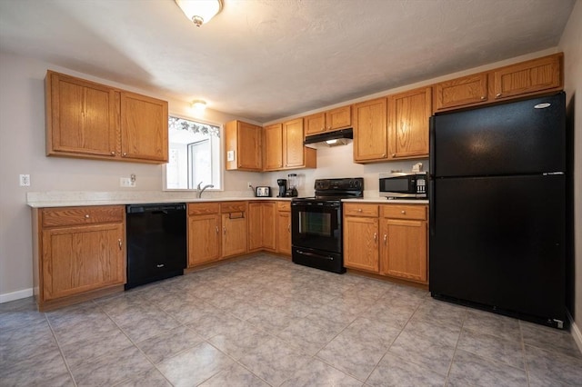 2 Garden St, Uxbridge, MA 01569 - kitchen featuring black appliances, under cabinet range hood, light countertops, a sink, and baseboards