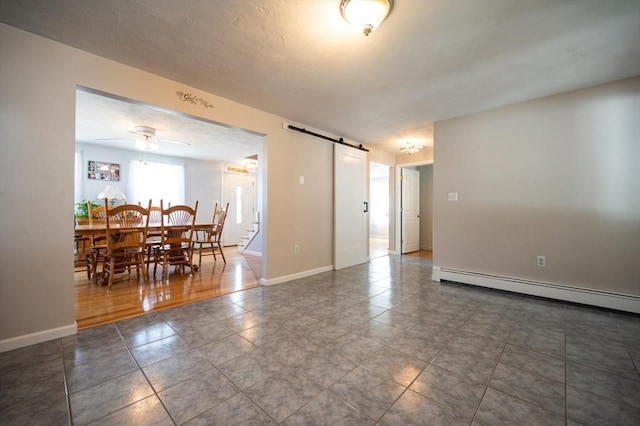 2 Garden St, Uxbridge, MA 01569 - tiled empty room featuring a barn door, baseboard heating, baseboards, and a ceiling fan