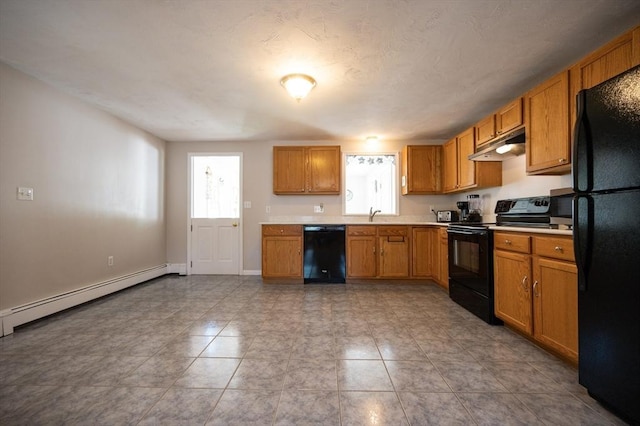 2 Garden St, Uxbridge, MA 01569 - kitchen featuring black appliances, under cabinet range hood, light countertops, baseboard heating, and a sink