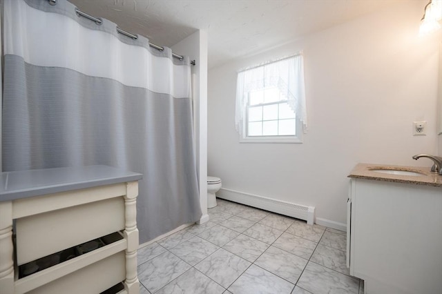 2 Garden St, Uxbridge, MA 01569 - bathroom with a baseboard heating unit, vanity, marble look tiles, toilet, and baseboards