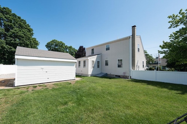 2 Garden St, Uxbridge, MA 01569 - rear view of property featuring a chimney and an outdoor structure