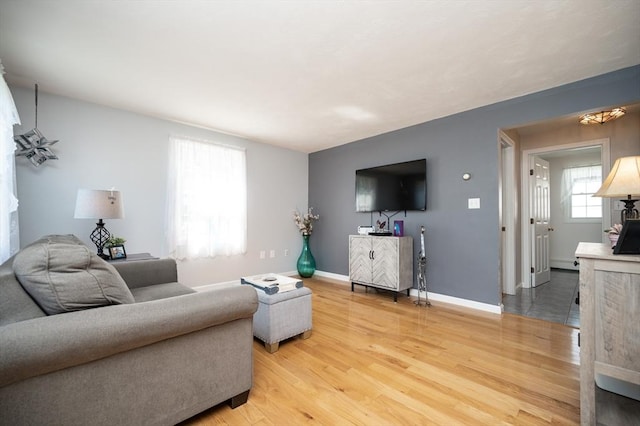 2 Garden St, Uxbridge, MA 01569 - living room with light wood-style floors and baseboards
