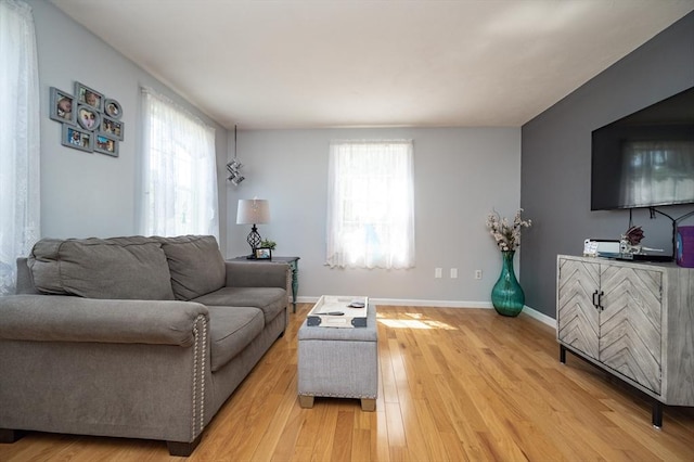 2 Garden St, Uxbridge, MA 01569 - living room featuring healthy amount of natural light, light wood-style flooring, and baseboards