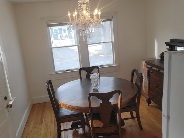 dining space featuring light wood-type flooring