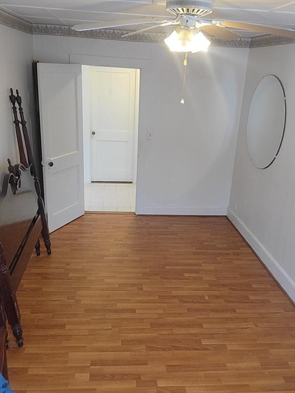 spare room featuring hardwood / wood-style floors and ceiling fan