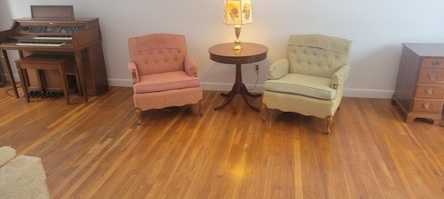 sitting room featuring hardwood / wood-style flooring