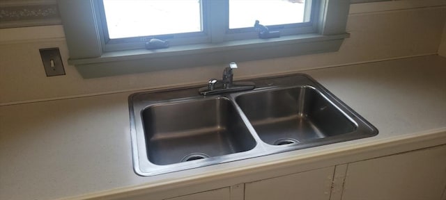 interior details with sink and white cabinets