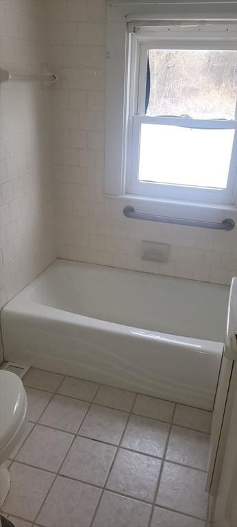 bathroom with tile patterned floors and toilet