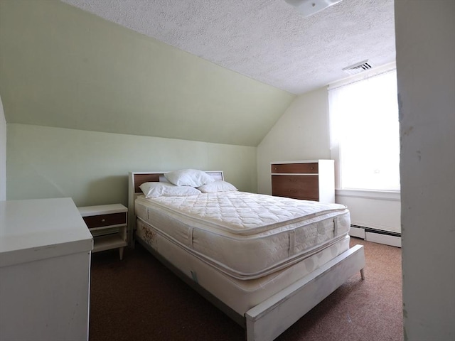 bedroom featuring a textured ceiling, visible vents, vaulted ceiling, a baseboard heating unit, and dark carpet