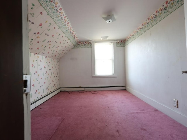 additional living space featuring carpet flooring, baseboards, visible vents, and lofted ceiling