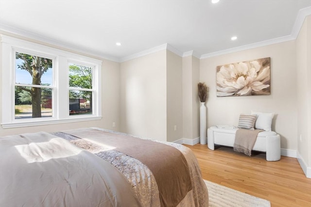 586 Lowell St, Peabody, MA 01960 - bedroom with light wood finished floors, ornamental molding, and recessed lighting