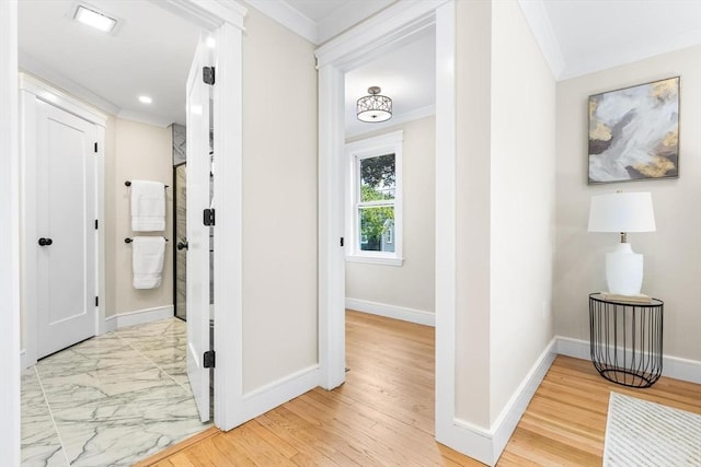 586 Lowell St, Peabody, MA 01960 - hallway featuring ornamental molding and light marble finish floors