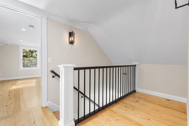 586 Lowell St, Peabody, MA 01960 - stairs featuring wood finished floors, vaulted ceiling, and recessed lighting