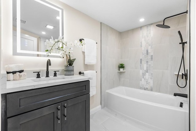 586 Lowell St, Peabody, MA 01960 - full bath with vanity, shower / bath combination, marble look tiles, and recessed lighting