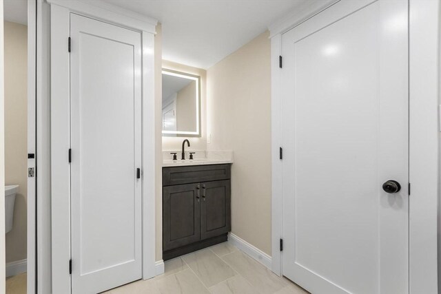 586 Lowell St, Peabody, MA 01960 - bathroom with vanity and marble finish floors
