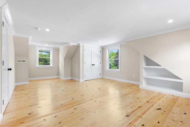 586 Lowell St, Peabody, MA 01960 - additional living space with light wood-style floors, built in features, and recessed lighting