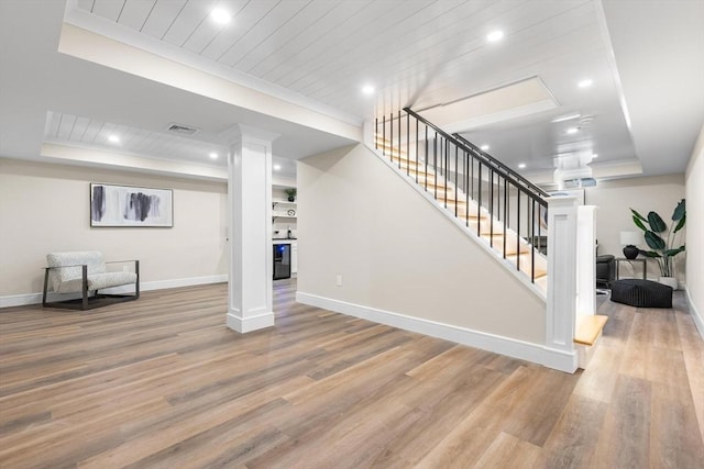 586 Lowell St, Peabody, MA 01960 - unfurnished living room featuring wood finished floors, stairs, recessed lighting, a raised ceiling, and wood ceiling