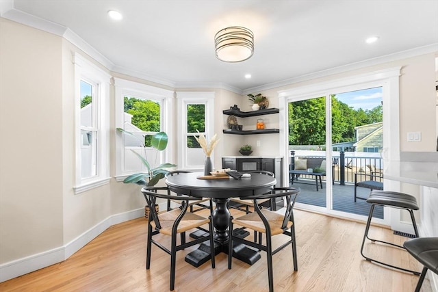 586 Lowell St, Peabody, MA 01960 - dining space with ornamental molding, plenty of natural light, light wood-style floors, and recessed lighting