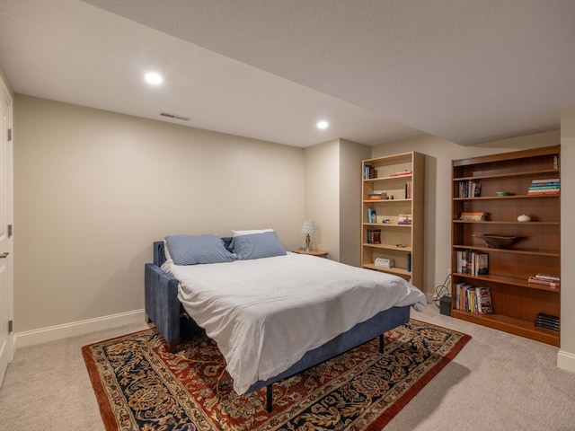 bedroom with light colored carpet