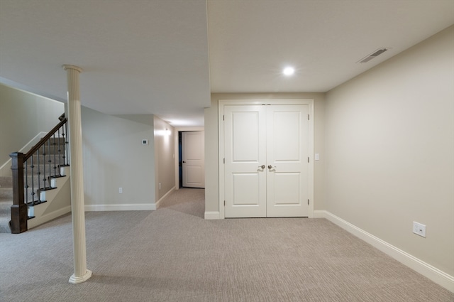 basement featuring light colored carpet