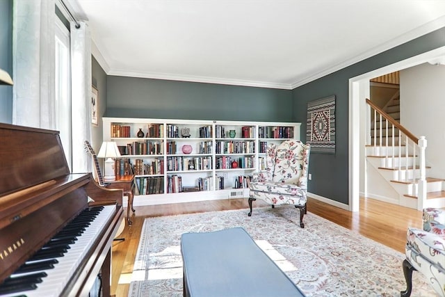 76 Wildflower Cir, Westfield, MA 01085 - sitting room featuring crown molding, wood finished floors, and stairway