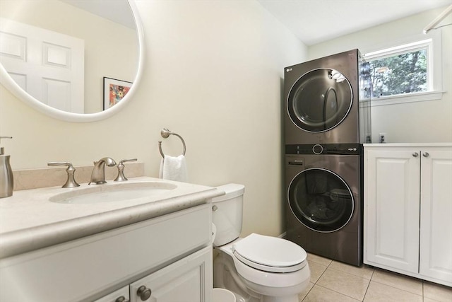 76 Wildflower Cir, Westfield, MA 01085 - bathroom featuring stacked washer / dryer, tile patterned floors, and vanity