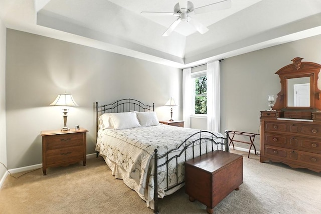 76 Wildflower Cir, Westfield, MA 01085 - bedroom featuring a tray ceiling, light carpet, and ceiling fan