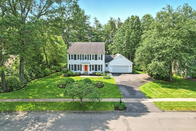 76 Wildflower Cir, Westfield, MA 01085 - colonial home featuring asphalt driveway, an attached garage, and a front lawn