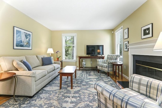 76 Wildflower Cir, Westfield, MA 01085 - living area with a fireplace with flush hearth and wood finished floors