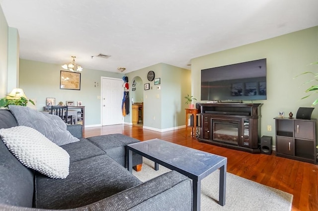 230 Willard St Unit 412, Quincy, MA 02169 - living area featuring a chandelier, wood finished floors, and baseboards