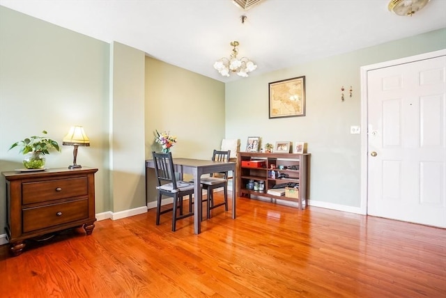 230 Willard St Unit 412, Quincy, MA 02169 - dining room with wood finished floors, a chandelier, and baseboards
