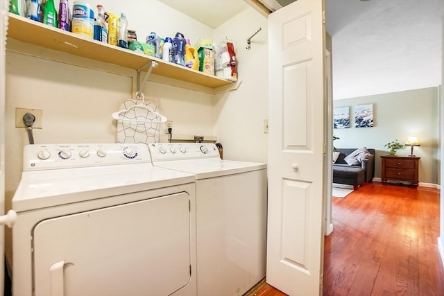 230 Willard St Unit 412, Quincy, MA 02169 - laundry area with washing machine and clothes dryer and light wood-style floors