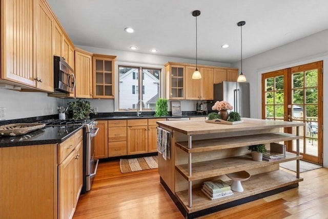 454 Webster St, Needham, MA 02494 - kitchen featuring open shelves, stainless steel appliances, butcher block counters, a sink, and light wood finished floors