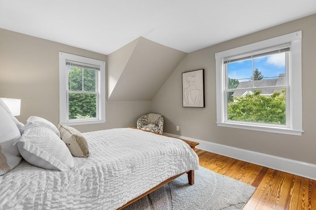 454 Webster St, Needham, MA 02494 - bedroom featuring baseboards, wood finished floors, and vaulted ceiling