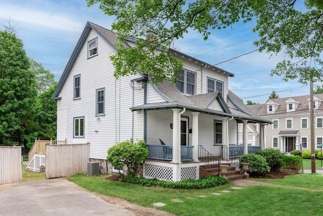 454 Webster St, Needham, MA 02494 - view of front of property featuring a porch, central AC, a front lawn, and a shingled roof