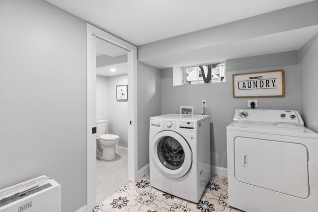 454 Webster St, Needham, MA 02494 - laundry room with washer and dryer and baseboards