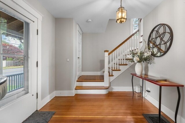 454 Webster St, Needham, MA 02494 - foyer with wood finished floors, stairs, and baseboards